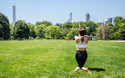 Full length of woman in park against clear sky