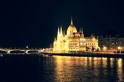 High angle view of illuminated hungarian parliament building in city at night