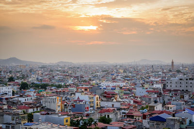 High angle view of townscape against sky during sunset