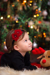 Portrait of boy with christmas tree