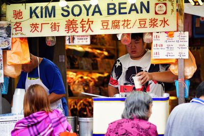 Group of people at market stall