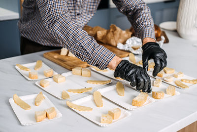 Cropped hand of person preparing food