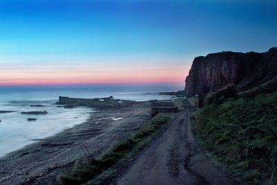 Scenic view of sea at sunset