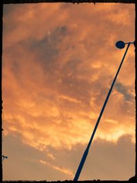 Low angle view of cloudy sky at sunset