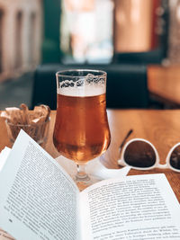 Close-up of beer glass on table