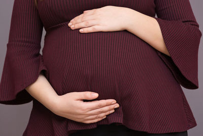 Midsection of woman with hands