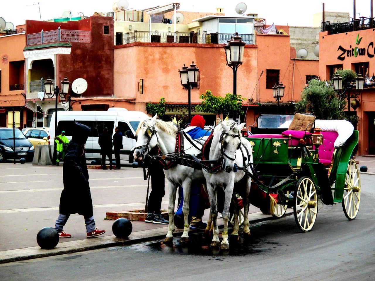 domestic animals, mammal, transportation, horse cart, mode of transport, built structure, building exterior, architecture, horsedrawn, day, outdoors, livestock, men, city