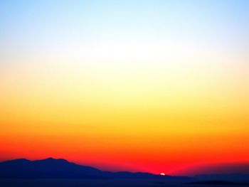 Scenic view of mountains at sunset