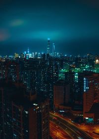 High angle view of illuminated buildings in city at night