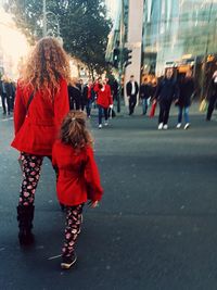 Full length of woman standing on city street