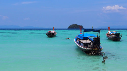 Boat in sea against sky