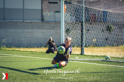 Man playing soccer on field