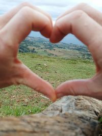 Close-up of hand shaping heart