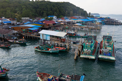 High angle view of boats moored in sea against sky