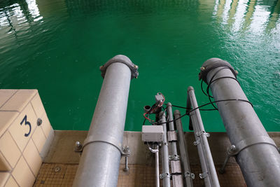 High angle view of water pipe on railing