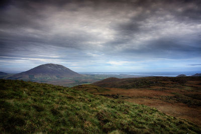 View of landscape against cloudy sky