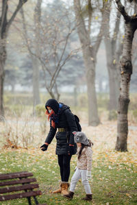 Mom and daughter searching for some special leafs