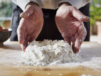 Midsection of person preparing food