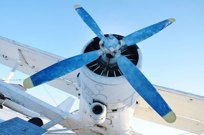 Low angle view of airplane propeller against sky