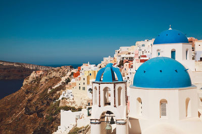 Church and buildings in city at santorini