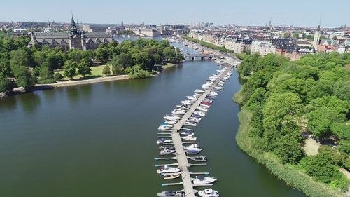 High angle view of river amidst buildings in city