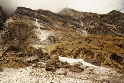 Rock formations on mountain against sky