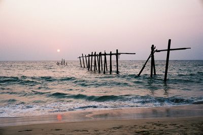 Scenic view of sea against clear sky during sunset