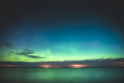 Scenic view of sea against sky at night