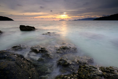 Scenic view of sea against sky during sunset