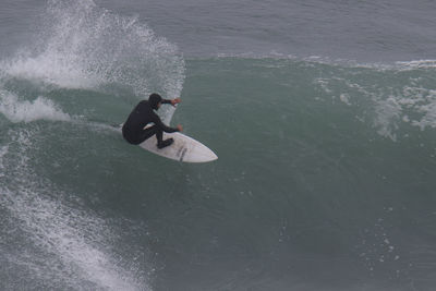 High angle view of man surfing in sea