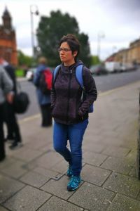 Portrait of young woman standing outdoors