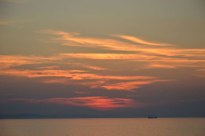 Scenic view of sea against orange sky