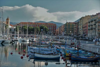 Boats moored at harbor