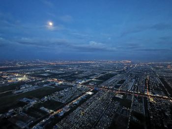 High angle view of illuminated city buildings at night