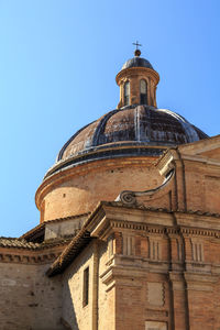 Low angle view of a building against blue sky