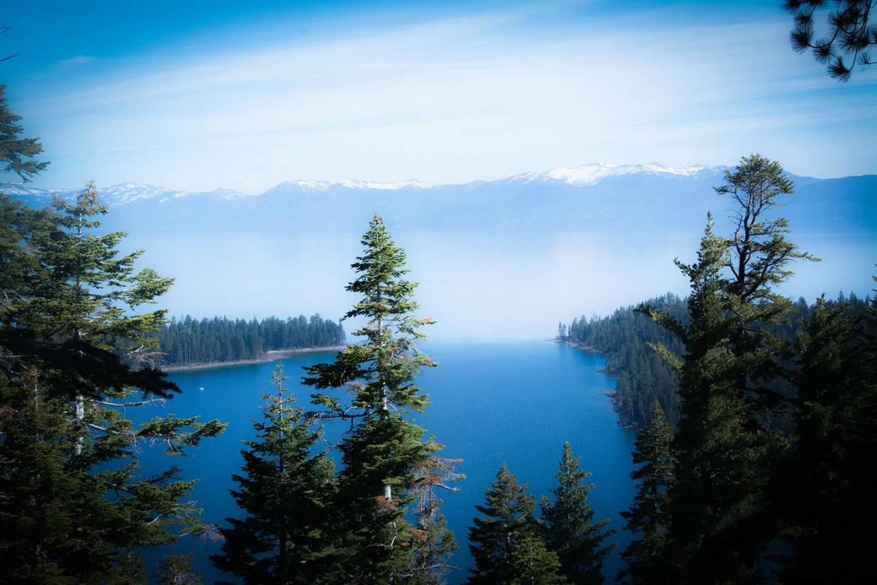 SCENIC VIEW OF LAKE WITH MOUNTAINS IN BACKGROUND