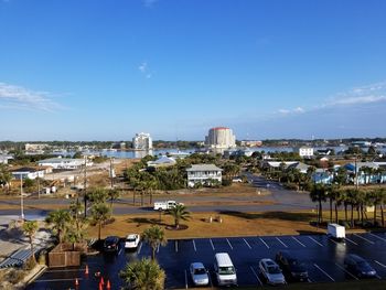 High angle view of cityscape against blue sky