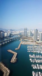 Marine city aerial view featuring skyscrapers and boats