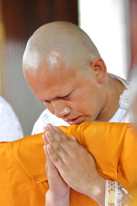 Monk praying during ordination