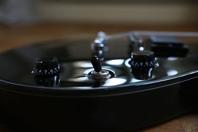 High angle view of guitar on table