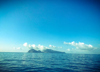 Scenic view of sea against clear blue sky