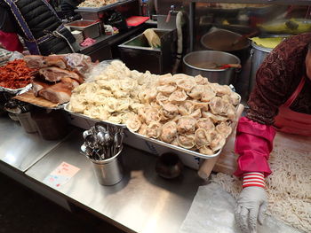 Man preparing food for sale at market