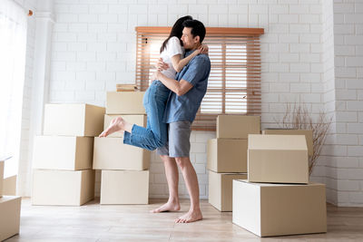 Side view of young couple at home