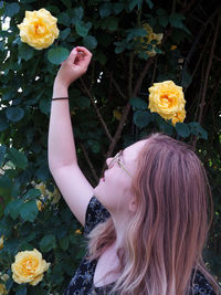 Portrait of woman with pink flowers