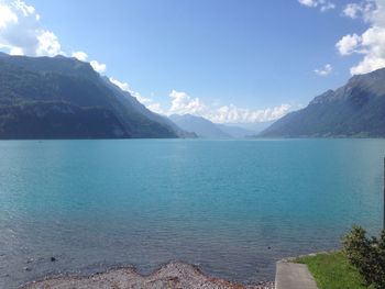 Scenic view of lake and mountains against sky