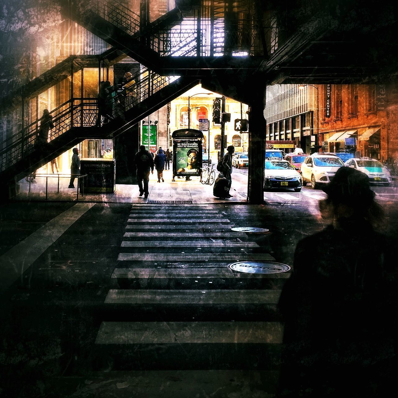 MAN WALKING ON SIDEWALK IN CITY AT NIGHT