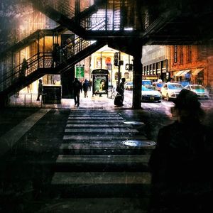People walking in city at night