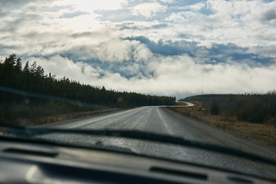 Road seen through car windshield