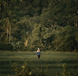 Woman standing on field