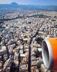 Aerial view of cityscape seen through airplane window